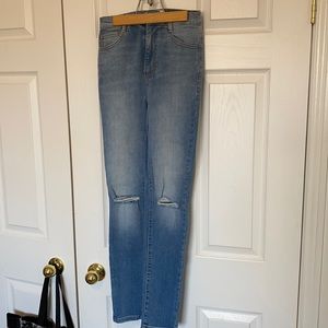 High waisted jeans with knee rips